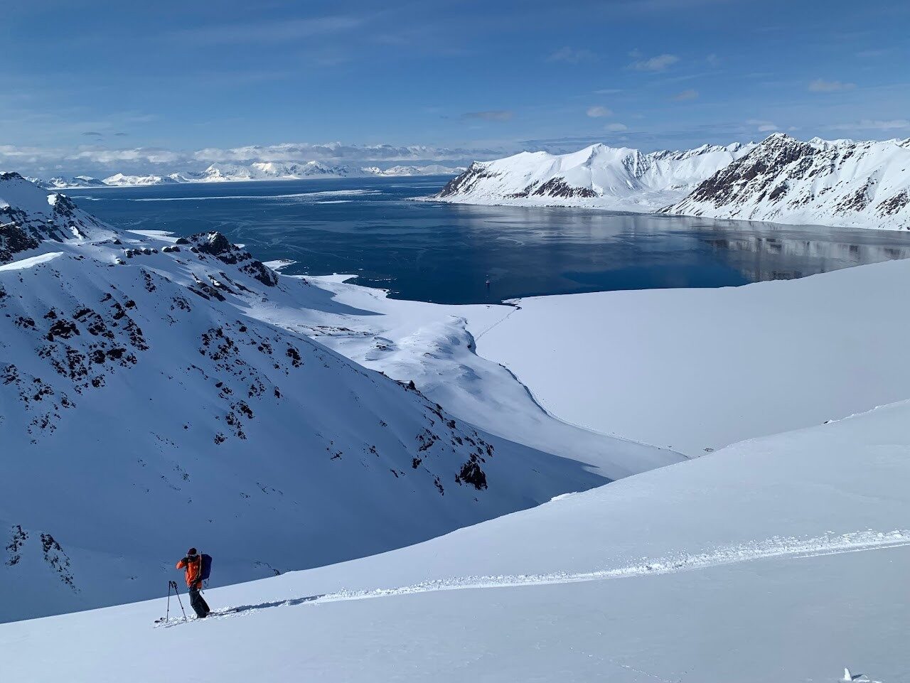 Ski tourers crossing an Arctic snowfield in Svalbard